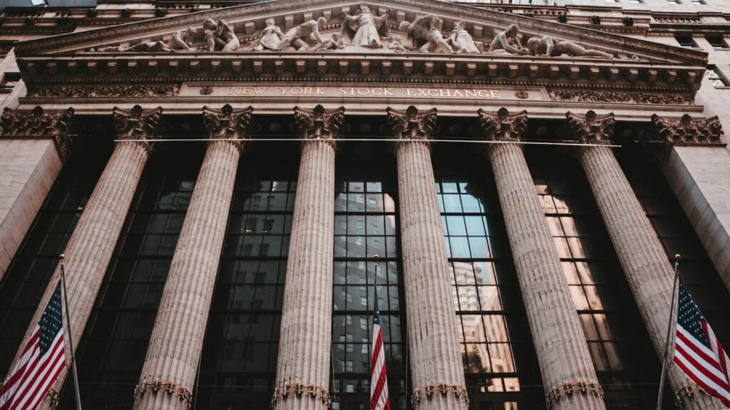 Wall Street bull statue representing AI bubble bear warnings