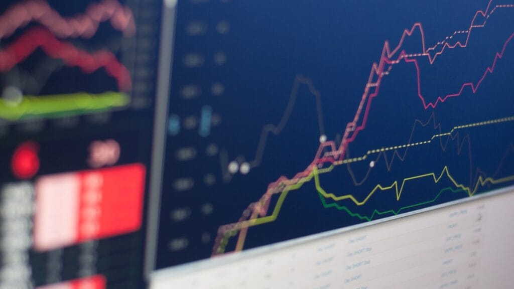 Financial market trading screens showing red losses