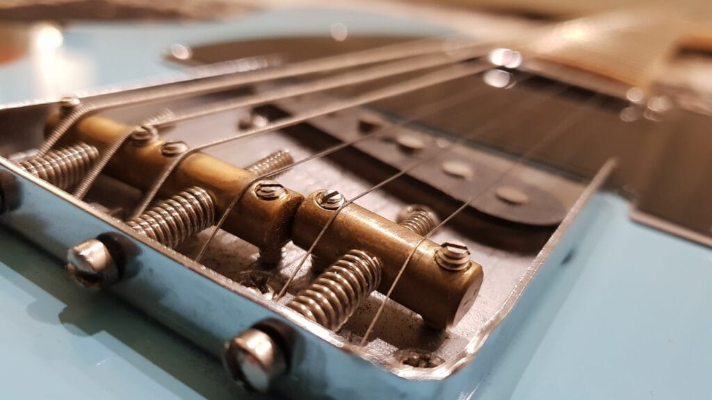 Close-up of guitar strings representing quantum memory stored as mechanical vibrations