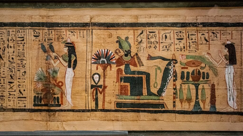 Ancient Egyptian hieroglyphs carved into stone