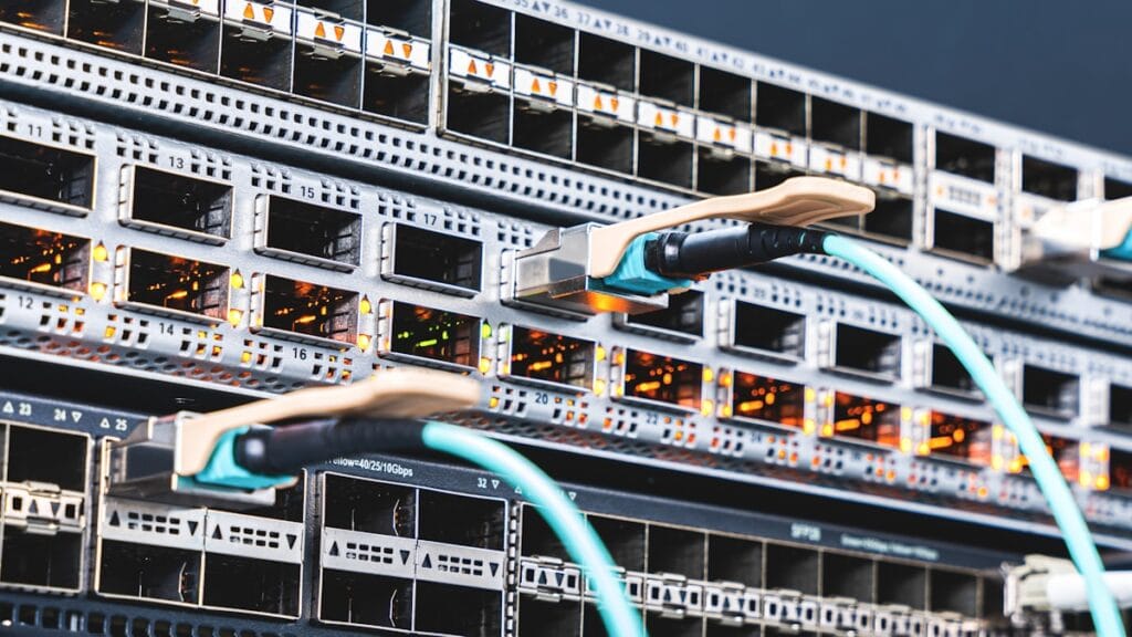 Blue-lit server and network hardware in a data centre