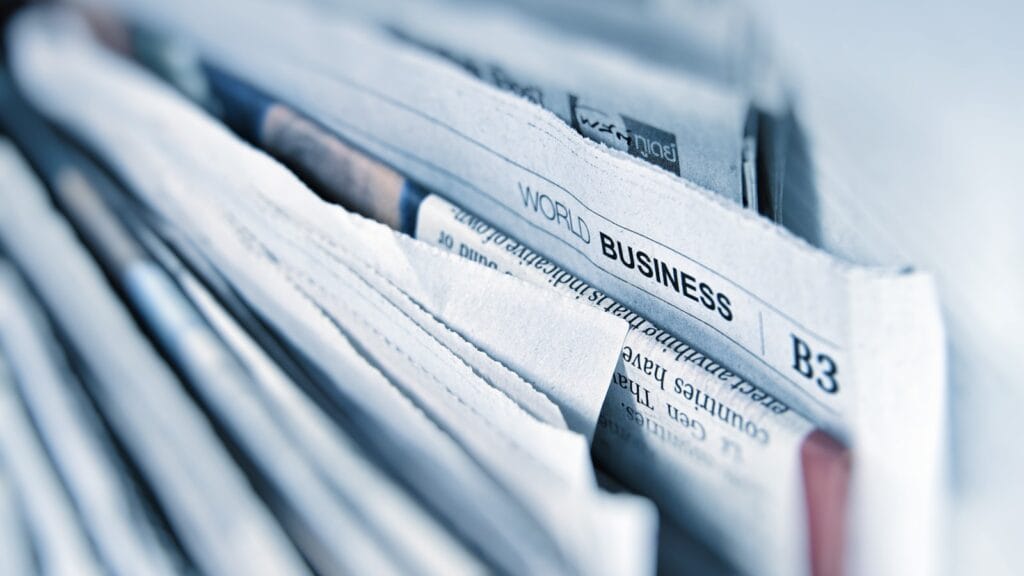 A stack of printed newspapers