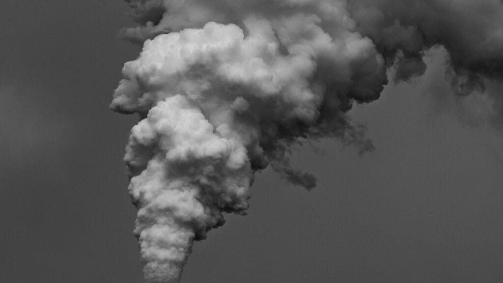 Industrial power plant emitting exhaust into the sky